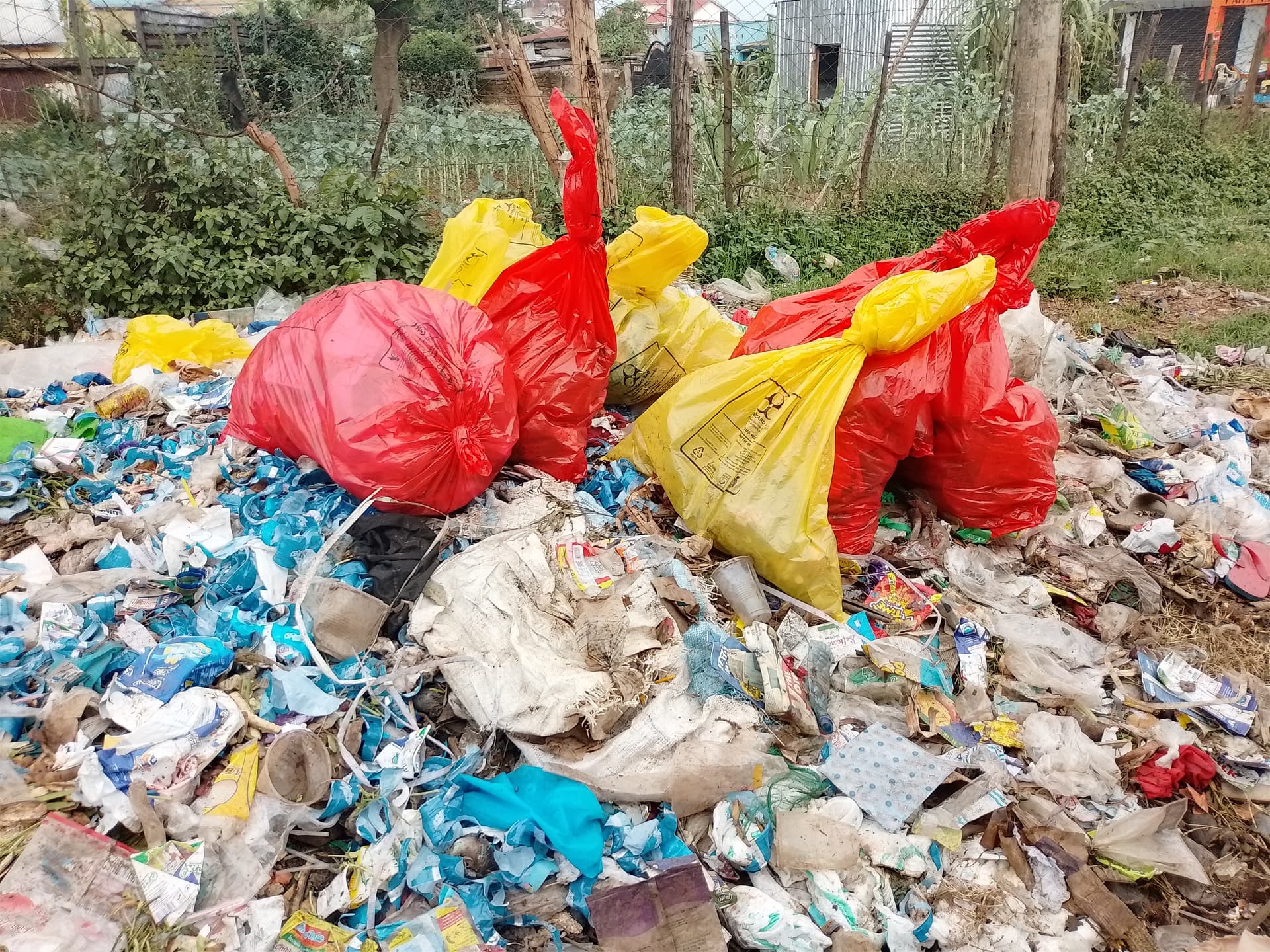 Before: Remove all that waste because it's near a market place in kakamega county,